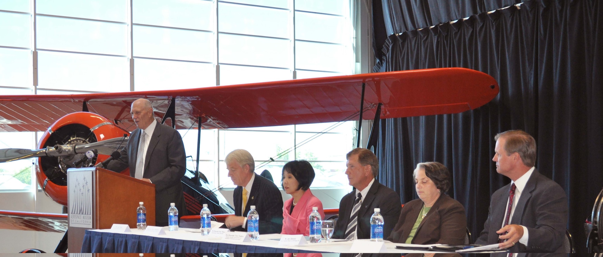 Larry Kelley, president of McClellan Business Park, provides remarks Aug. 12, during a ceremony to transfer some 560 acres of the former McClellan AFB in Sacramento, Calif., to Sacramento County officials. Those officials estimate that when fully developed the business park will host some 35,000 jobs and generate millions of dollars in tax revenue. (Photo by Tim Huynh)
