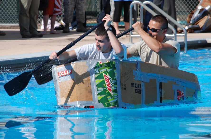 LAUGHLIN AIR FORCE BASE, Texas – Second Lt. Mike Fountain and Senior Airman Oscar Pena, both 47th Flying Training Wing staff, compete in the 2010 Laughlin Build-a-Boat Race just before their boat sinks at Friendship Pool here Sept. 2. The wing staff team was awarded best team cheer by the judges. Competitors were given single-ply cardboard and duct tape as supplies to build their boat and allowed to use nothing else. (U.S. Air Force photo by Airman 1st Class Blake Mize)