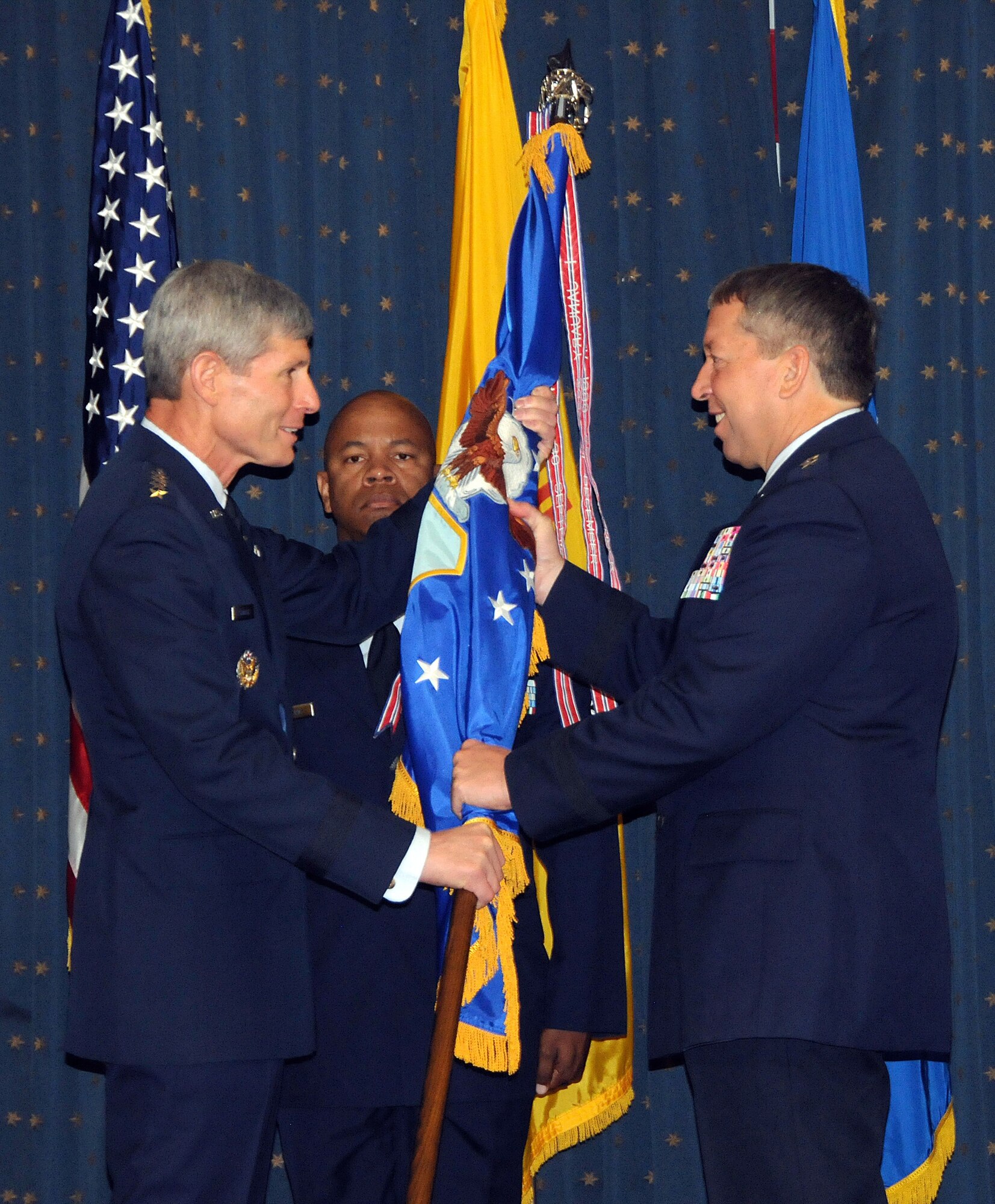 Air Force Chief of Staff Gen. Norton Schwartz (left) passes the Air Force
Safety Center guidon to Maj. Gen. Gregory A. Feest, the new AFSC commander,
in a change-of-command ceremony on Sept. 1, 2010, at Kirtland Air Force
Base, N.M.  U.S. Air Force photo by Dennis Carlson
