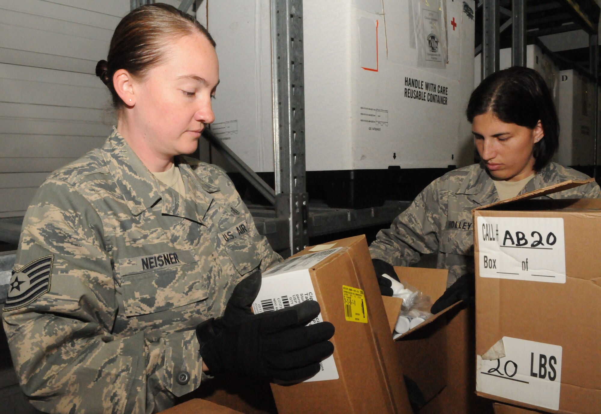 ZEMMER, Germany – Tech. Sgt. Sheryl Neisner, 52nd Medical Support Squadron NCO in charge of medical war reserve material, reviews lot numbers and expiration dates on pharmaceutical items with Staff Sgt. Alexandra Holley, 52nd MDSS war reserve material crew chief of a supply warehouse in Zemmer Sept. 1. These items will be shipped out and used to treat patients in the event of a major catastrophe locally or downrange. Approximately $5 million of medical supplies and equipment are stored in this warehouse. (U.S. Air Force photo/Senior Airman Nick Wilson)