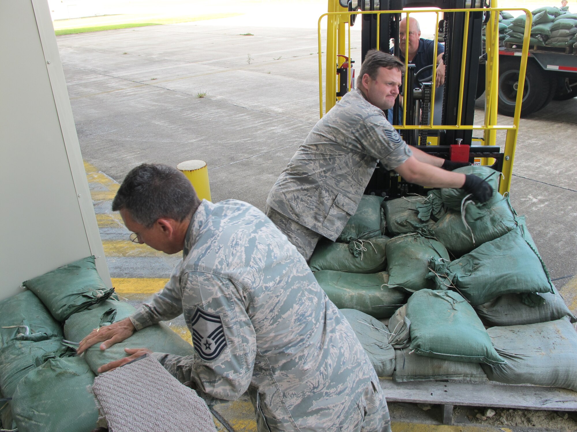 On September 2, 2010 the 102d Intelligence Wing located on Cape Cod began preparing for Hurricane Earl which is expected to reach the Cape and Islands by late Friday. Senior Master Sgt Dale Swartz and Technical Sgt. Brian Savage build a sand bag barrier used to protect buildings from water damage as heavy rains and wind from the storm are expected.
