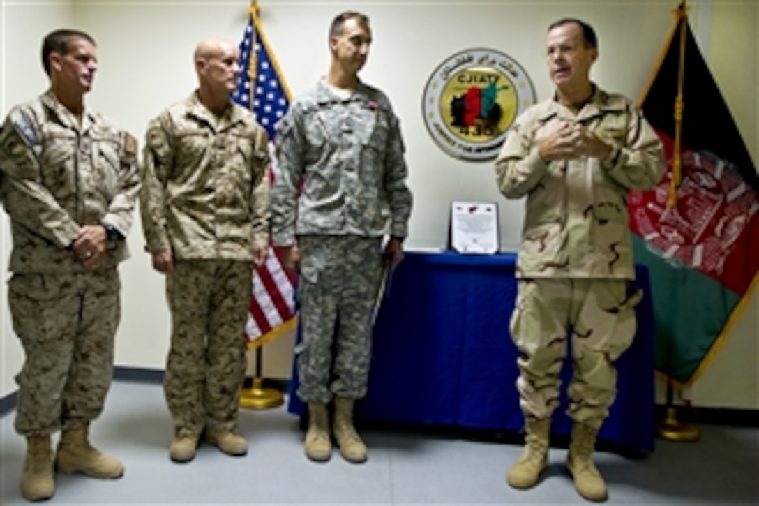 U.S. Navy Special Operations Master Chief Robert Edwards, U.S. Navy Vice Adm. Robert S. Harward and U.S. Army Brig. Gen. Mark Martins listen as U.S. Navy Adm. Mike Mullen, chairman of the Joint Chiefs of Staff, addresses the Combined Joint Interagency Task Force 435 in Kabul, Afghanistan, Sept. 3, 2010. The joint task force has the responsibility for U.S. detention and correction. Edwards is its senior enlisted leader and Harward is its commander.