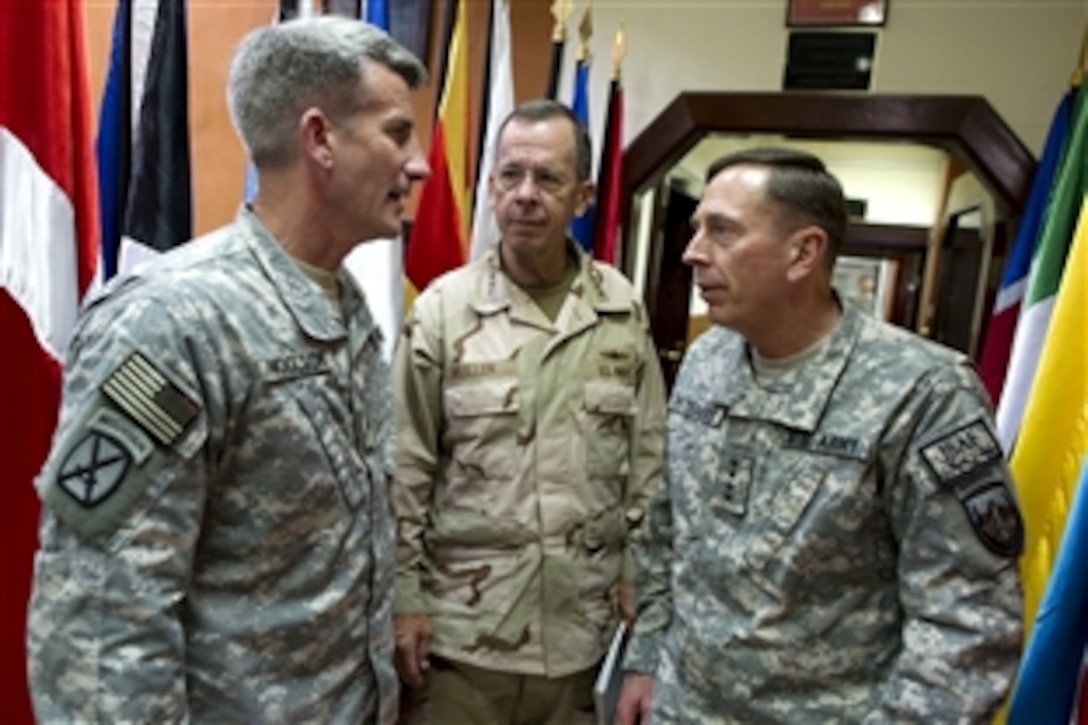 U.S. Navy Adm. Mike Mullen, chairman of the Joint Chiefs of Staff, and U.S. Army Gen. David H Petraeus, commander of the International Security Assistance Force, speak with U.S. Army Brig. Gen. John W. Nicholson Jr., director of the force's Pakistan-Afghanistan Coordination Cell, in Kabul, Afghanistan, Sept. 3, 2010. Mullen made a short stop in the Afghan capital to address Combined Joint Interagency Task Force 435 and receive an operational update from Petraeus.