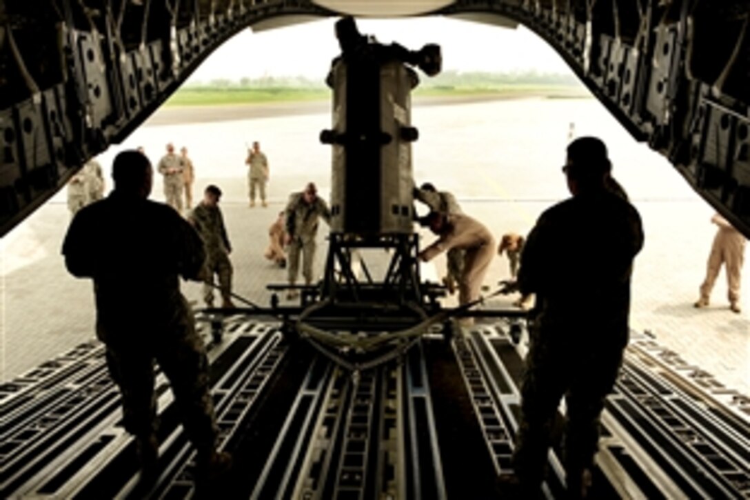 A U.S. Air Force C-17 Globemaster III aircraft delivers a CH-47 Chinook helicopter from the 16th Combat Aviation Brigade, Ft. Wainwright, Ak., to Chaklala Air Force Base, Pakistan in support of flood relief efforts, Sept. 2, 2010. The C-17 crew is assigned to the 535th Airlift Squadron, Hickam Air Force Base, HI. The brigade is at Chaklala AFB, awaiting their helicopters.