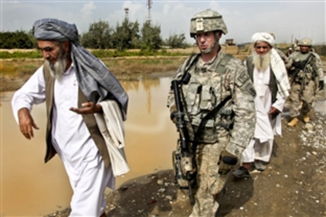 U.S. Army Capt. Christopher Brooks and his soldiers meet with Janqudam Malik to discuss his concerns with the village road following heavy rains in Afghanistan's Parwan province, Sept. 1, 2010. Brooks, a commander, is assigned to Company A, 86th Brigade Special Troops Battalion, 86th Infantry Brigade Combat Team.