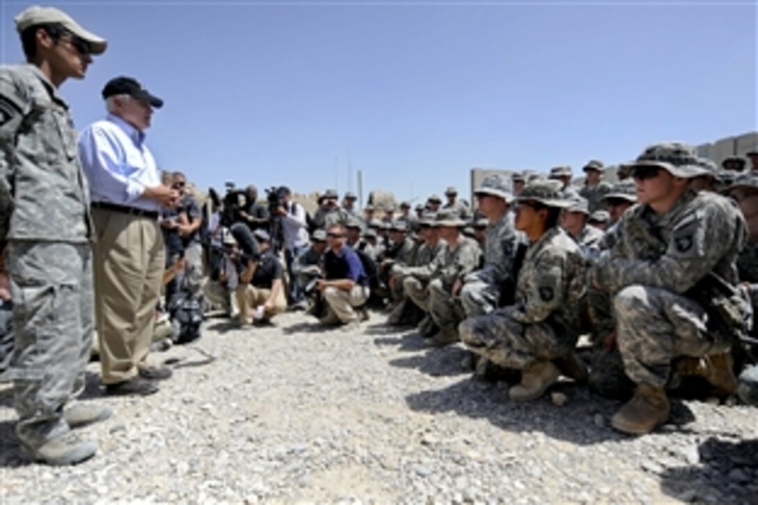 U.S. Defense Secretary Robert M. Gates talks with U.S. Army soldiers after presenting them with Purple Hearts and other awards on Command Outpost Senjaray, Afghanistan, Sept. 3, 2010. The soldiers are assigned to the 101st Airborne Division's 1st Battalion, 502nd Infantry Regiment.
