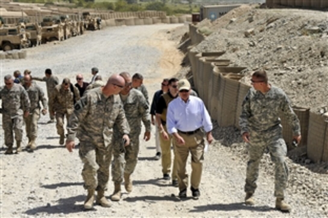 U.S. Defense Secretary Robert M. Gates walks with U.S. Army leaders on Command Outpost Senjaray, Afghanistan, Sept. 3, 2010. Gates earlier handed out awards and coins to soldiers on the outpost. The leaders and soldiers are assigned to the 101st Airborne Division's 1st Battalion, 502nd Infantry Regiment.