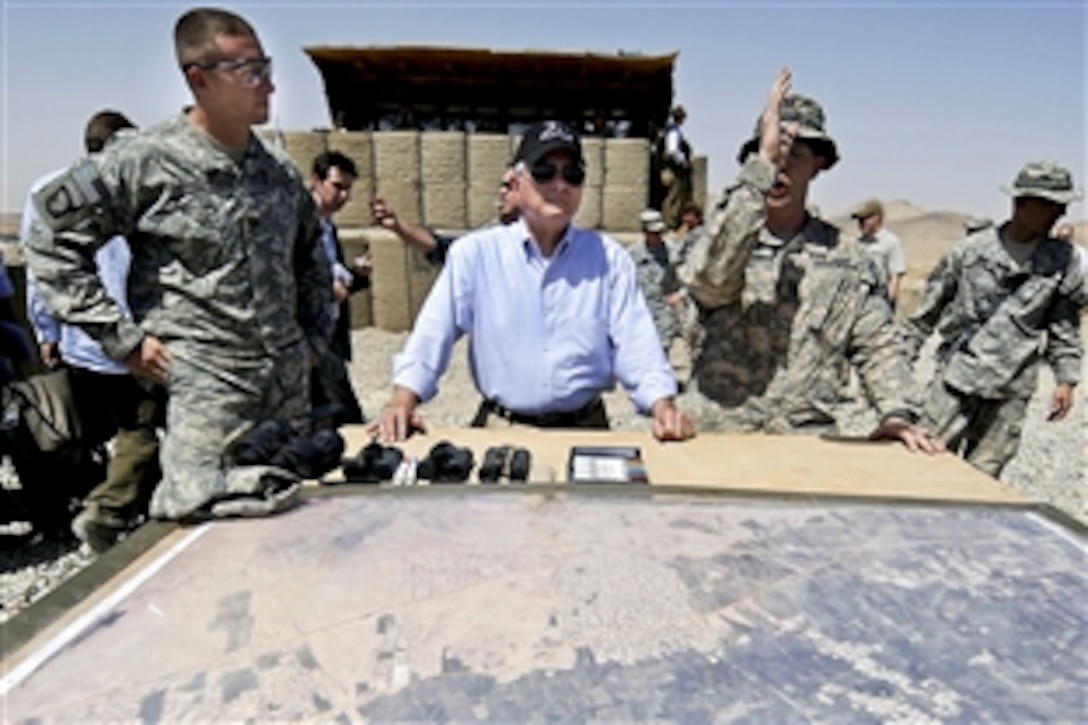 U.S. Defense Secretary Robert M. Gates receives a tour of the Eagle's Nest from U.S. Army soldiers after presenting them with Purple Hearts, coins and other awards on Command Outpost Senjaray, Afghanistan, Sept. 3, 2010. The soldiers are assigned to the 101st Airborne Division's 1st Battalion, 502nd Infantry Regiment.