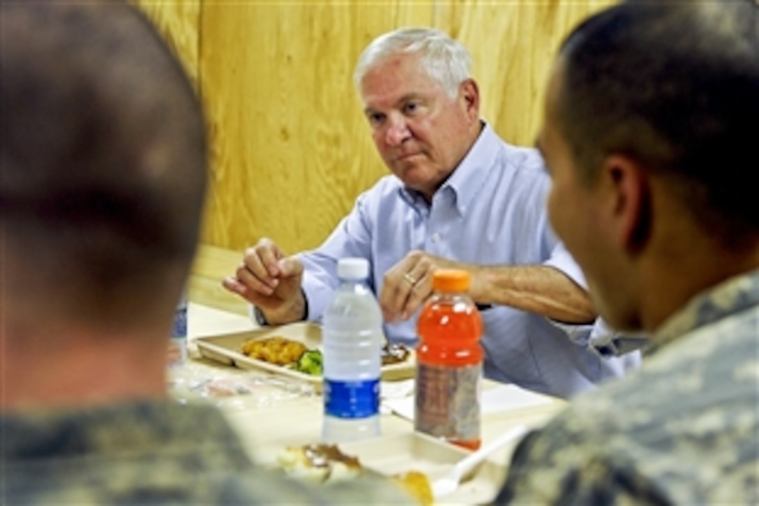 U.S. Defense Secretary Robert M. Gates lunches with U.S. Army soldiers on Command Outpost Senjaray, Afghanistan, Sept. 3, 2010. Gates handed out awards and coins to the soldiers, who are assigned to the 101st Airborne Division's 1st Battalion, 502nd Infantry Regiment.