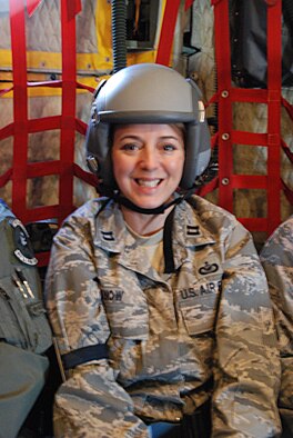 Capt. Cathleen Snow, 920th Rescue Wing Chief of Public Affairs, flies as a passenger aboard a C-130 flight. (Courtesy photo) 
