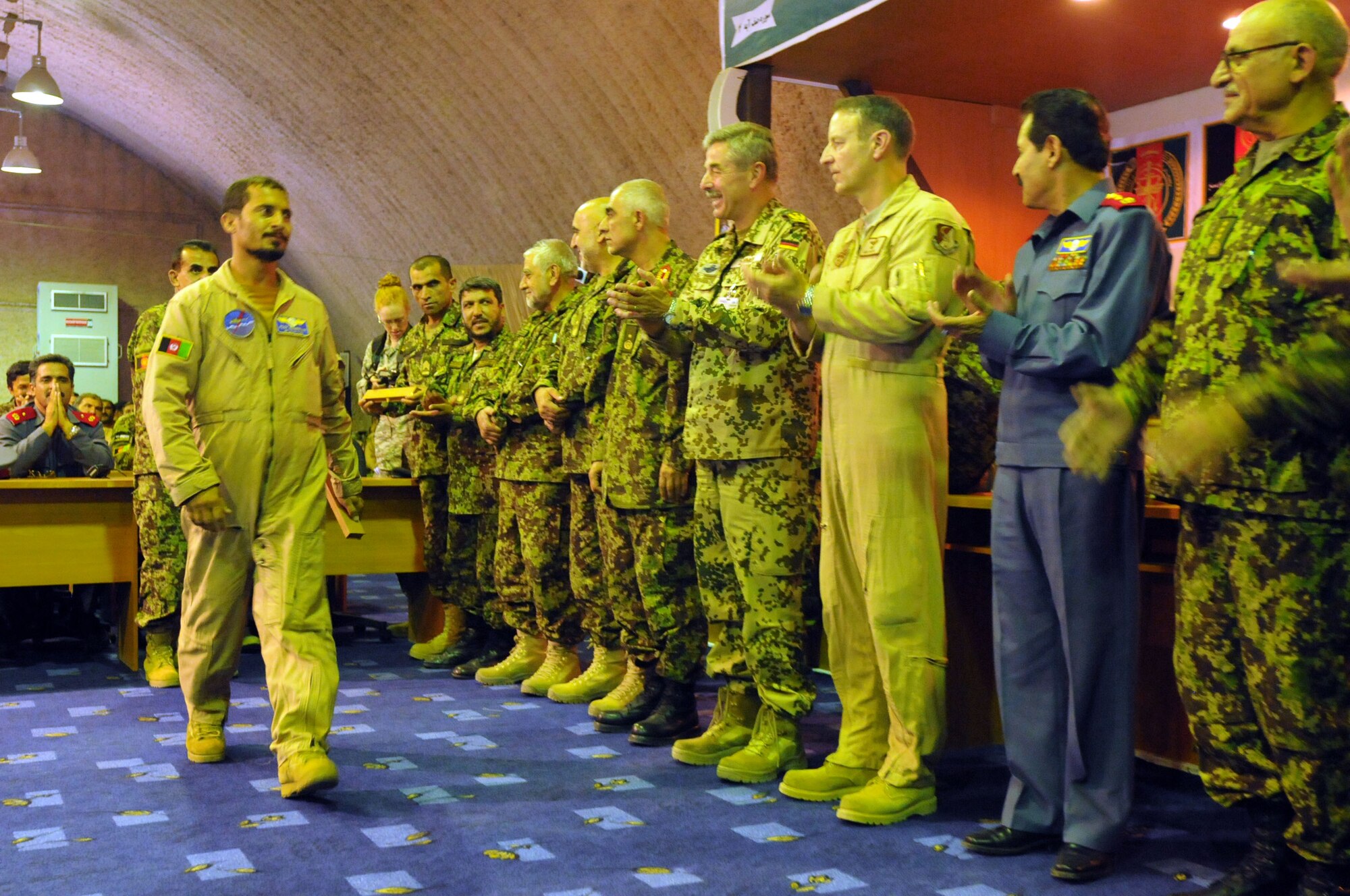 100904-N-6031Q-014 KABUL, Afghanistan -Afghan Air Force personnel are welcomed back home during a ceremony in the conference center of the AAF base in Kabul on Sep. 4, 2010 after providing flood relief to the neighboring country of Pakistan. Over the last 27 days, members of the AAF have been carrying out lifesaving humanitarian missions in Pakistan, demonstrating their strong operational capabilities. (US Navy photo by Mass Communication Specialist 2nd Class David Quillen/ RELEASED).