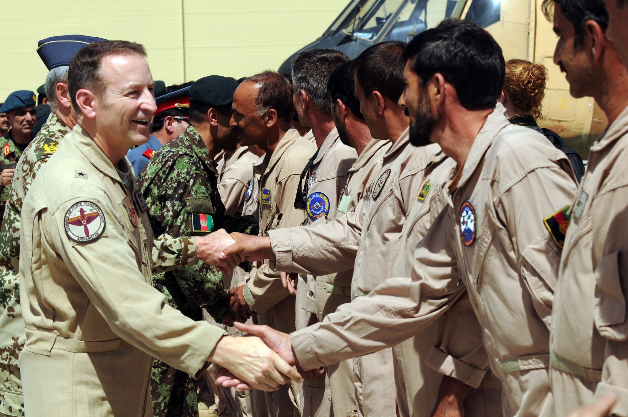 100904-N-6031Q-006 KABUL, Afghanistan -Afghan Air Force personnel are welcomed back home by Brig. Gen. Michael Boera, Commanding General, 438th Air Expeditionary Wing, Combined Air Power Transition Force, on the flight line of the AAF base in Kabul on Sep. 4, 2010 after providing flood relief to the neighboring country of Pakistan. Over the last 27 days, members of the AAF have been carrying out lifesaving humanitarian missions in Pakistan, demonstrating their strong operational capabilities. (US Navy photo by Mass Communication Specialist 2nd Class David Quillen/ RELEASED).
