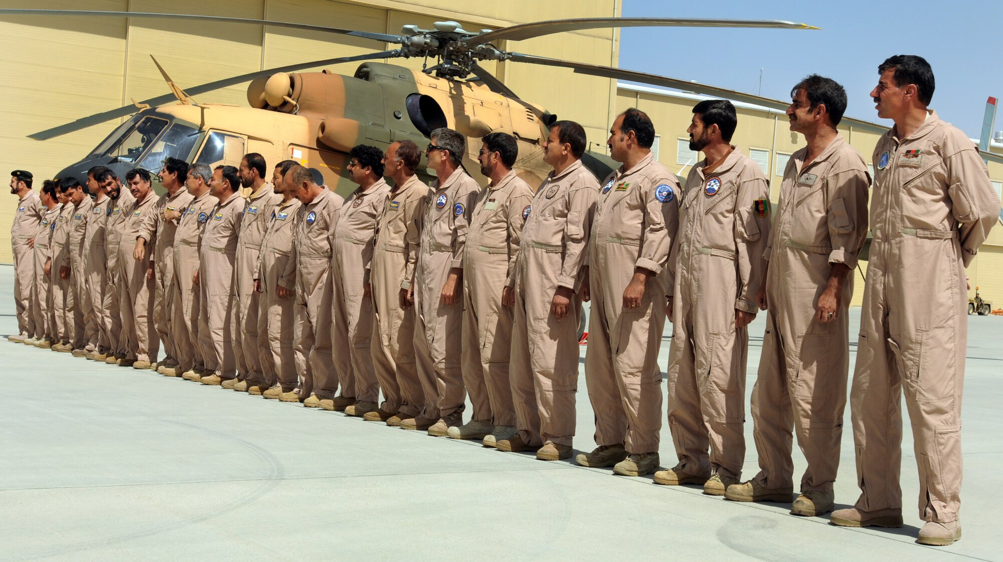 100904-N-6031Q-004 KABUL, Afghanistan -Afghan Air Force personnel are welcomed back home on the flight line of the AAF base in Kabul on Sep. 4, 2010 after providing flood relief to the neighboring country of Pakistan. Over the last 27 days, members of the AAF have been carrying out lifesaving humanitarian missions in Pakistan, demonstrating their strong operational capabilities. (US Navy photo by Mass Communication Specialist 2nd Class David Quillen/ RELEASED).