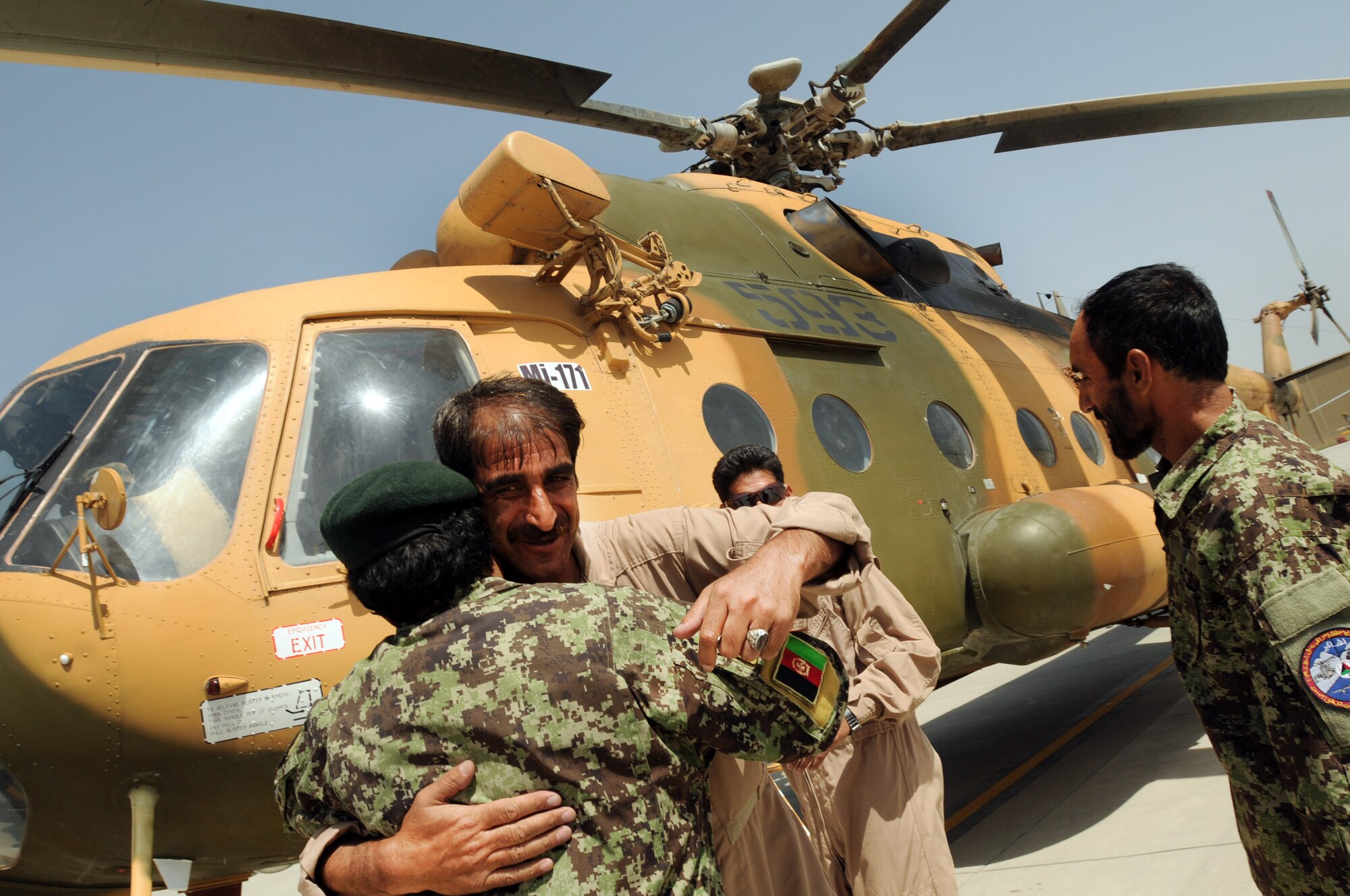 100904-N-6031Q-003 KABUL, Afghanistan -Afghan Air Force personnel are welcomed back home on the flight line of the AAF base in Kabul on Sep. 4, 2010 after providing flood relief to the neighboring country of Pakistan. Over the last 27 days, members of the AAF have been carrying out lifesaving humanitarian missions in Pakistan, demonstrating their strong operational capabilities. (US Navy photo by Mass Communication Specialist 2nd Class David Quillen/ RELEASED).