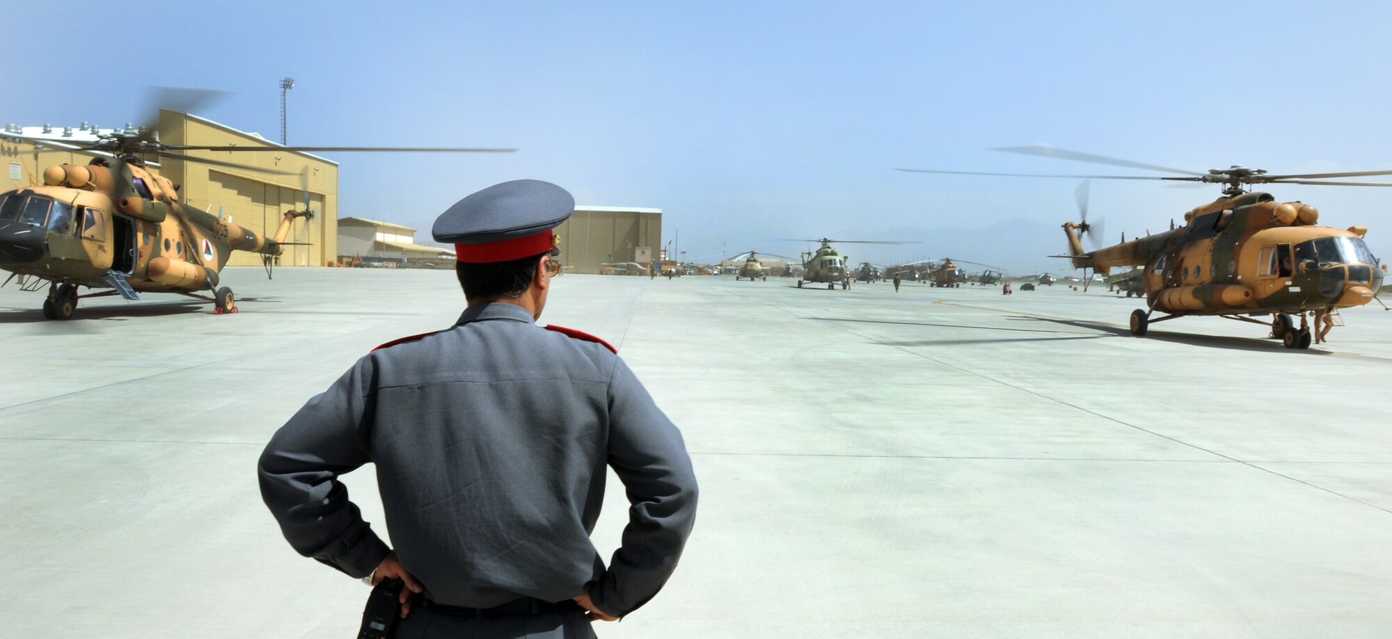 100904-N-6031Q-002 KABUL, Afghanistan -Afghan Air Force personnel are welcomed back home on the flight line of the AAF base in Kabul on Sep. 4, 2010 after providing flood relief to the neighboring country of Pakistan. Over the last 27 days, members of the AAF have been carrying out lifesaving humanitarian missions in Pakistan, demonstrating their strong operational capabilities. (US Navy photo by Mass Communication Specialist 2nd Class David Quillen/ RELEASED).