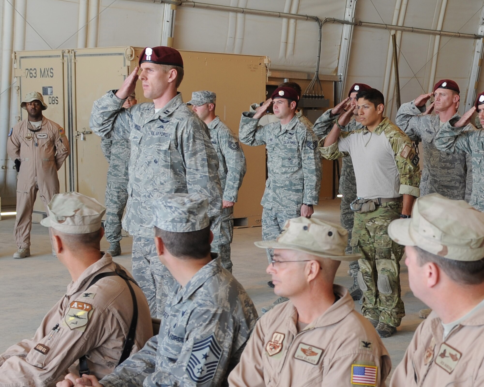 Airmen of the 46th Expeditionary Rescue Squadron render their first salute to Maj. Steven Simone during the squadron’s assumption of command ceremony on Sept. 2, 2010 at Camp Bastion, Afghanistan. Major Simone is the commander of the 46th ERQS and is deployed from the 38th Rescue Squadron, Moody Air Force Base, Ga. (U.S. Air Force photo by Tech. Sgt. Chad Chisholm/Released)