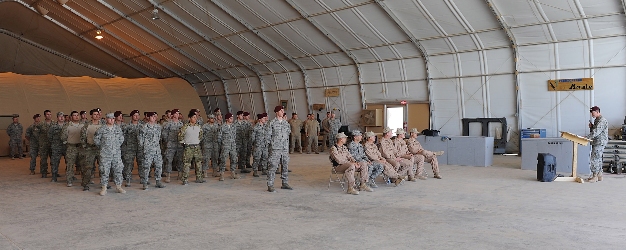 Maj. Steven Simone addresses Airmen of the 46th Expeditionary Rescue Squadron following his assumption of command on Sept. 2, 2010 at Camp Bastion, Afghanistan.  Major Simone is the commander of the 46th ERQS and is deployed from the 38th Rescue Squadron, Moody Air Force Base, Ga. (U.S. Air Force photo by Tech. Sgt. Chad Chisholm/Released)