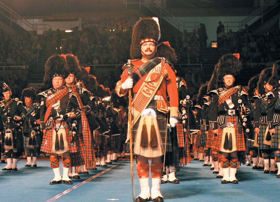 The Vancouver Police Pipe Band stand proudly at the beginning of the Canadian Naval Centennial Tattoo in the Pacific National Exhibition coliseum Saturday. The MarForPac Band played along side them in honor of the  100th anniversary of the Royal Canadian Navy.