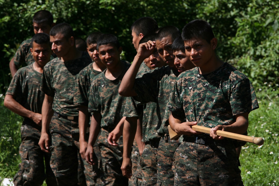 Guatemalan Regular Army troops wait in line to practice bayonet thrust techniques under the supervision of Marine Corps Martial Arts instructors with Special-Purpose Marine Air-Ground Task Force Continuing Promise 2010 aboard Poptun Training Camp in Poptun, Guatemala, Sept. 6.  Aside from conducting subject-expert matter exchanges with Guatemalan Special Forces soldiers or "Kaibiles," the Marines with Special-Purpose MAGTF CP2010 Marine Corps Martial Arts Program instruction was given to the Guatemalan soldiers in relevance to non-lethal weapons techniques for crowd control and rapid and effective distribution of relief supplies in the event of a disaster relief operation. ::r::::n::::r::::n::