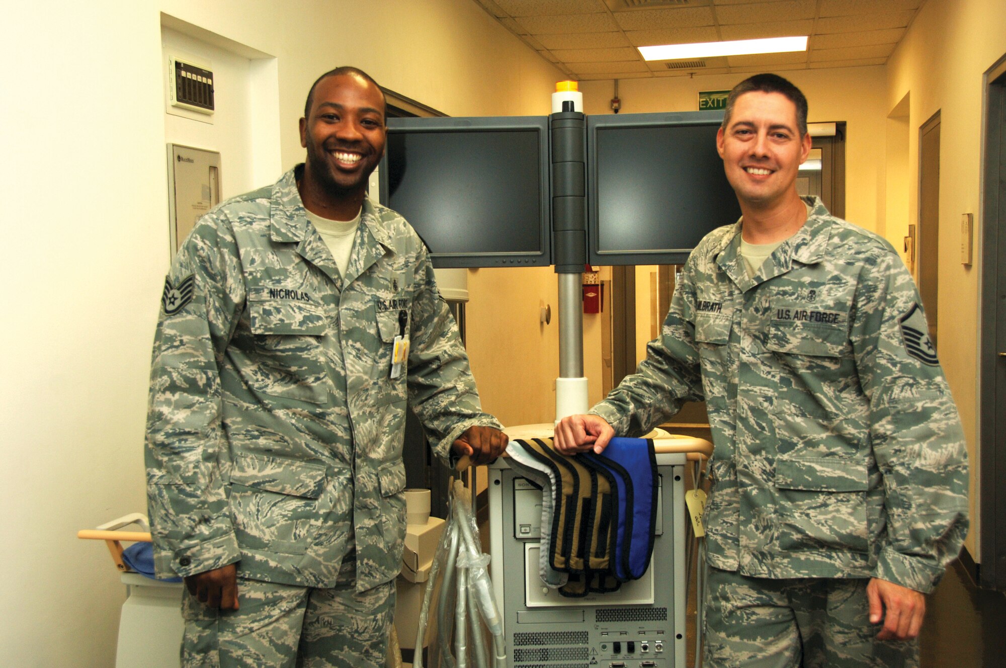 Staff Sgt. Jahmal Nicholas and Master Sgt. Bruce Milbrath, 379th Expeditionary Medical Group radiology technicians, show off their portable X-ray machine. (U.S. Air Force photo/Tech. Sgt. Kimberly Spinner) 
