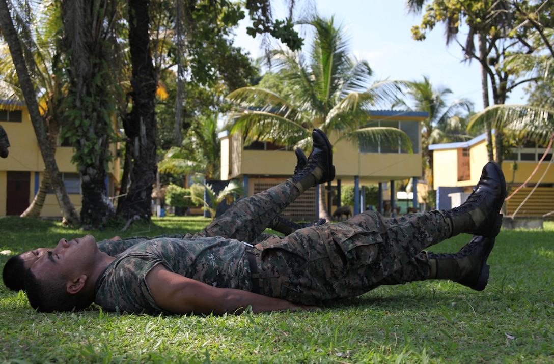Guatemalan Marines execute a U.S. Marine Corps exercise while waiting to learn Marine Corps Martial Arts, Sept. 7, during a MCMAP session taught by Marines with Special-Purpose Marine Air-Ground Task Force Continuing Promise 2010 at Puerto Santo Tomas de Castilla Naval Base in Guatemala. Marines with CP10 are currently deployed to the Caribbean, Central and South America conducting subject-matter expert exchanges and providing humanitarian civic assistance to host nations.