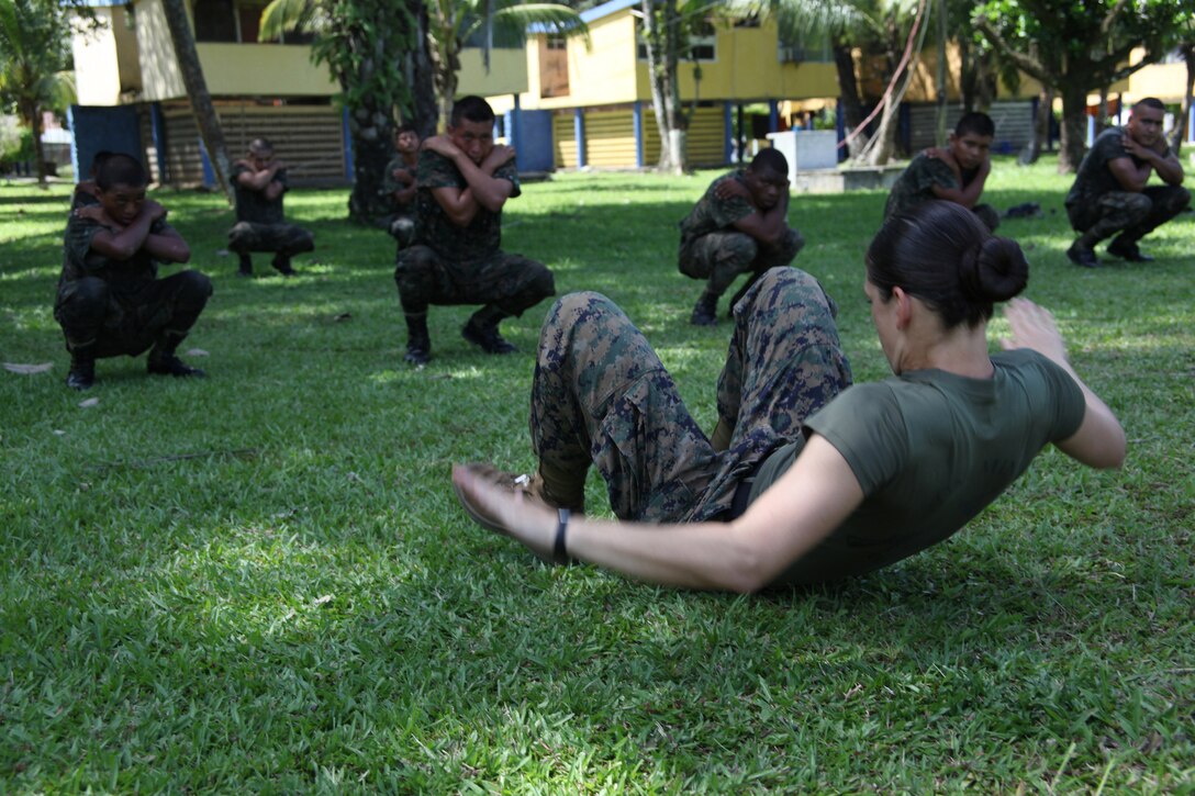 First Lt. Jessica M. Weinbrenner, the training officer with Marine Air Control Squadron 2, Command Element of Special-Purpose Marine Air-Ground Task Force Continuing Promise 2010, executes a U.S. Marine Corps martial arts back break-fall in front of Guatemalan Marines, Sept. 7, 2010, at Puerto Santo Tomas de Castilla Naval Base in Guatemala. Marines with Special-Purpose Marine Air-Ground Task Force Continuing Promise 2010 taught Marine Corps martial arts techniques to Guatemalan Marines for six days. Marines with CP10 are currently deployed to the Caribbean, Central and South America conducting subject-matter expert exchanges and providing humanitarian civic assistance to eight nations.