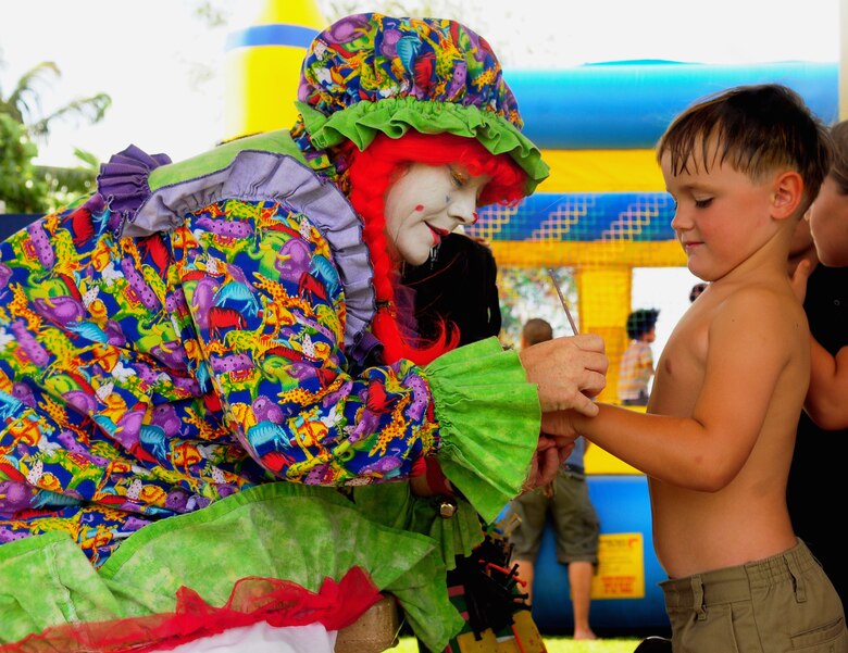 ANDERSEN AIR FORCE BASE, Guam ? Dozens of Airmen and their families attended the annual Labor Day Bash Sept. 3 at Arc Light Memorial Park. Face painting, water slides and a signing by the cast of Survivor were among the attractions available. (U.S. Air Force photo by Airman Whitney Amstutz)