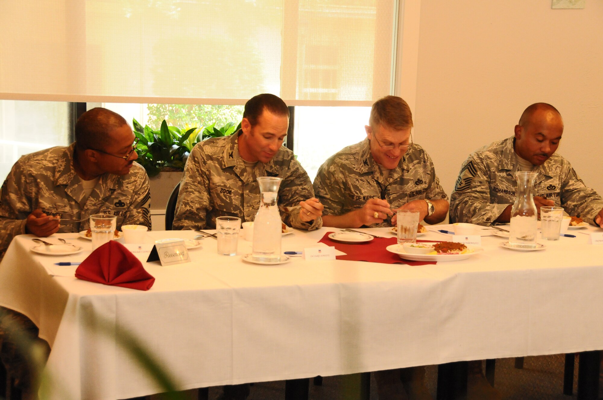 Chief Master Sgt. Dexter Mitchell, 1st SOW command chief, Col. Daniel Zook, 1st Special Operations Wing vice commander, Col. Curt Van De Walle, 1st Special Operations Mission Support Group commander, and Chief Master Sgt. Brian Richardson, 1st SOMSG superintendent, confer over a chef's submission during the Chef of the Quarter competition at the Reef Dining Facility at Hurlburt Field, Fla., Aug. 31, 2010. The 1st Special Operations Force Support Squadron holds the competition each quarter for Airmen to demonstrate their cooking abilities and talents.  (Courtesy photo by Barbara Fuller) (RELEASED)
