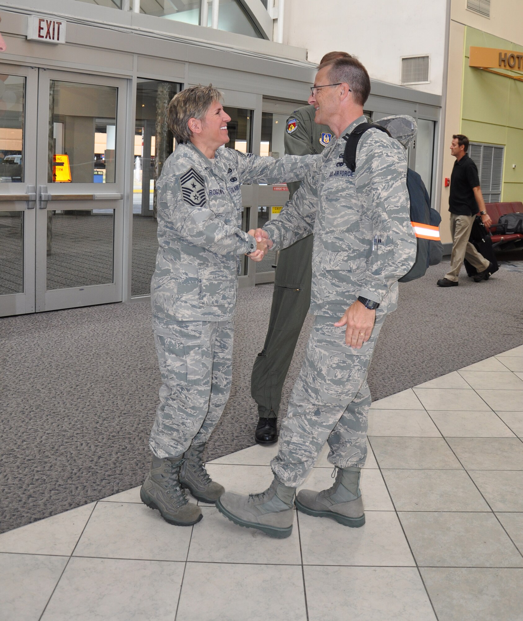 WRIGHT-PATTERSON AIR FORCE BASE, Ohio – Capt. Rodney McNany, 445th Airlift Wing Public Affairs, is greeted by Chief Master Sgt. Peri Rogowski, 445th Airlift Wing Command Chief, at the Dayton International Airport Sept. 7 after returning from a 6-month deployment to Southwest Asia. Captain McNany was assigned to the Joint Operations Center. (U.S. Air Force photo/Maj. Jose Cardenas)