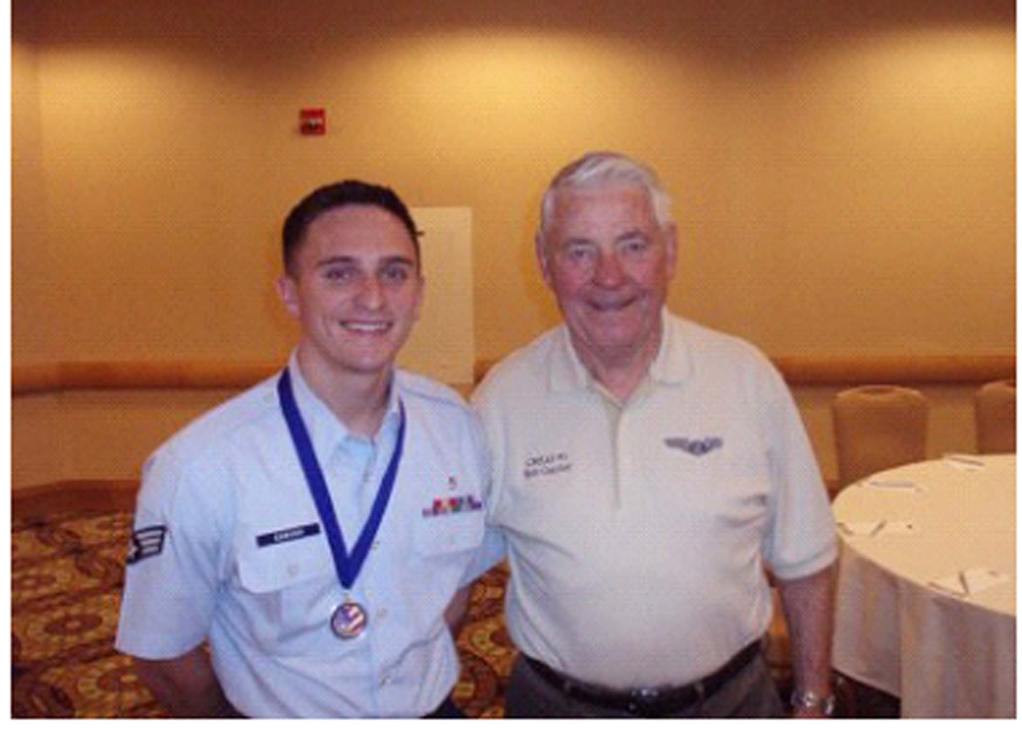Senior Airman Nicholas Carver stands with Chief Master Sergeant of the Air Force (retired) Robert Gaylor at the Air Force Sergeants Association annual conference. (Courtesy photo/AFSA)