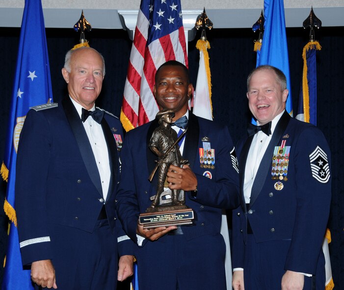 Lt. Gen. Harry M. Wyatt III, director of the Air National Guard, left, and Chief Master Sgt. Christopher E. Muncy, command chief master sergeant of the Air National Guard, right, present the Air Force Association's 2010 Air National Guard Outstanding Honor Guard Program Manager of the Year award to Master Sgt. Brian Mays, an Airman with the 188th Fighter Wing's Logistics Readiness Squadron, June 17 at Joint Base Andrews, Md. (Photo by National Guard Bureau Public Affairs)