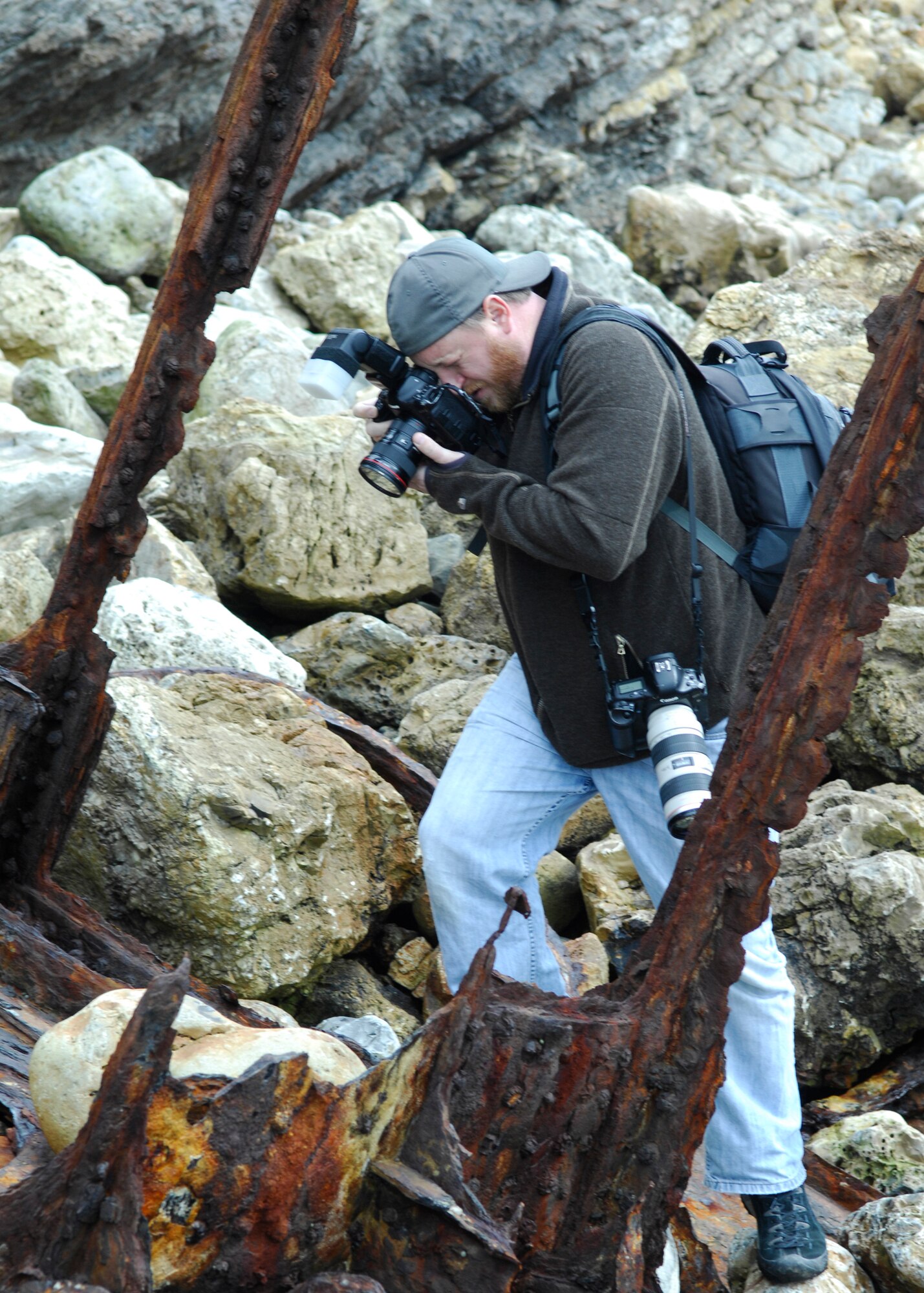 VANDENBERG AIR FORCE BASE, Calif.  -- Hoping to capture the interest of the community, Bryan Walton, a photographer for the Santa Maria Times, photographs wreckage from the crash of U.S.S. Chauncey on the coast of Vandenberg here Friday, Feb. 26, 2010. The crash, which happened in 1923, involved seven Navy destroyers and resulted in 23 deaths. (U.S. Air Force Photo/Senior Airman Heather Shaw)

