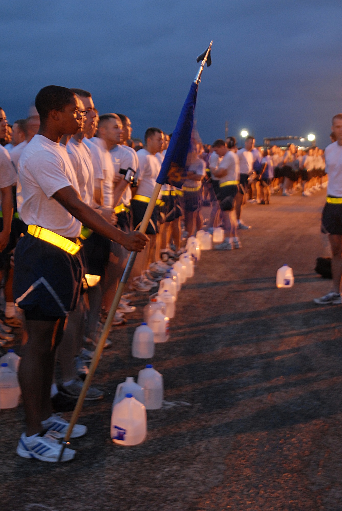GOODFELLOW AIR FORCE BASE, Texas -- 312th Training Squadron guideon bearer, Airman 1st Class Darryl Mosby and fellow firefighter students stand in formation before the official kick off of the Combined Federal Campaign and Wing Quarterly Sports Day, September 3. CFC is the world's largest and most successful annual workplace charity campaign, with more than 300 CFC campaigns throughout the country and internationally to help to raise millions of dollars each year. (U.S. Air Force photo/ Senior Airman Tong Duong)