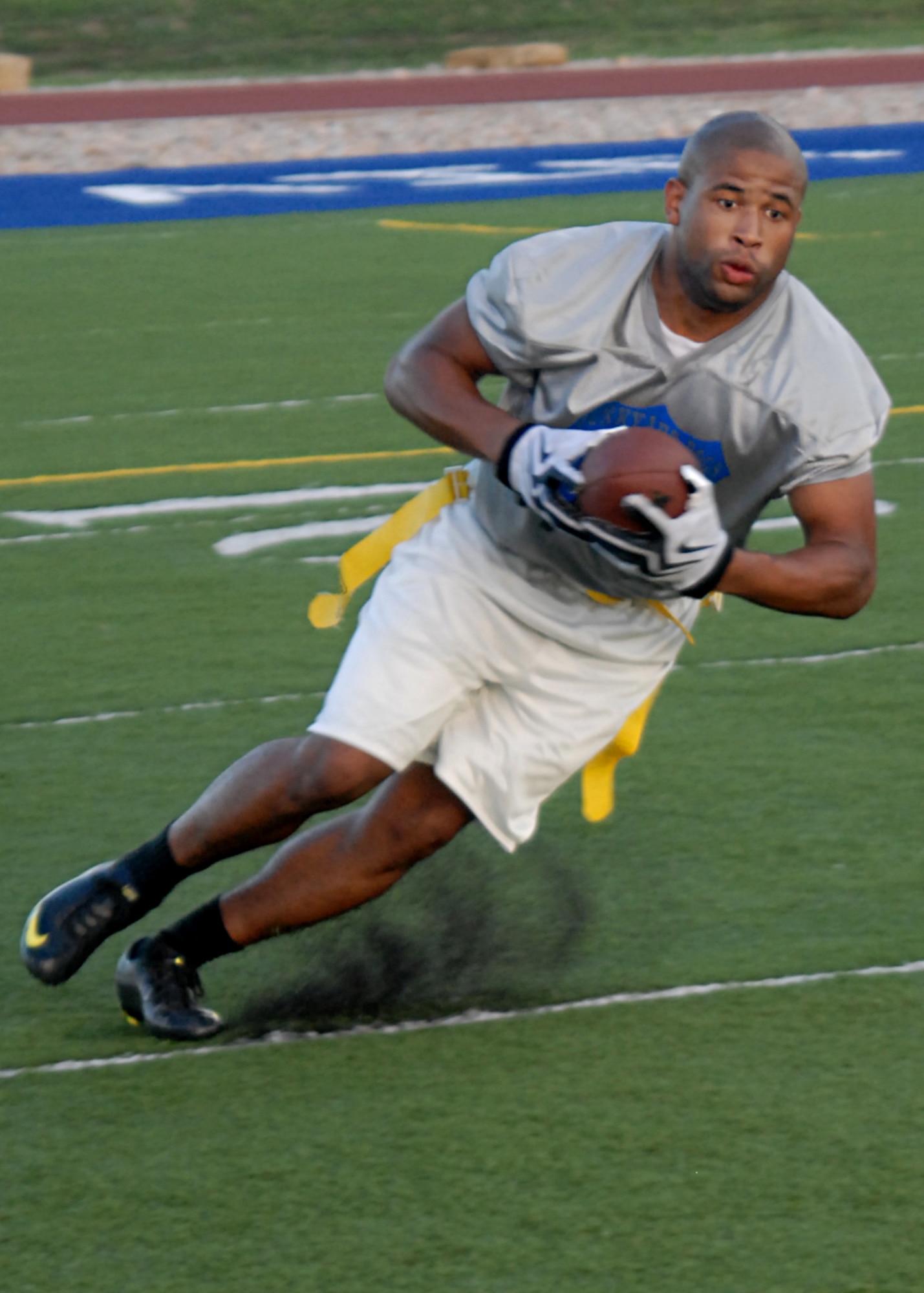 GOODFELLOW AIR FORCE BASE, Texas – Clifton Gathers, wide receiver for the 17th Mission Support Group Junkyard Dogs, catches a punt from 316th Training Squadron Sharks quarterback, during intramural football at the base football field, Sept. 2. Junkyard Dogs defeated the Sharks 19-6 during intramural play. (U.S. Air Force photo/ Senior Airman Tong Duong)