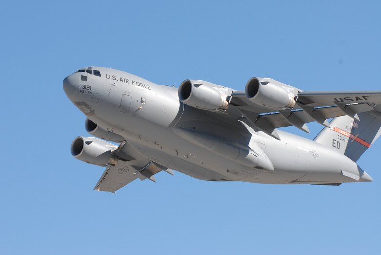 An Edwards' based C-17 Globemaster III takes off Aug. 27 to conduct a flight test to see how it performs with different combinations of biofuels. The aircraft was powered by 50-percent JP-8, 25-percent hydro-treated renewable jet fuel and 25-percent of a Fischer–Tropsch fuel. The 418th Flight Test Squadron conducted flight tests during the week using different combinations of regular JP-8 and the HRJ. (Air Force photo by Kenji Thuloweit)