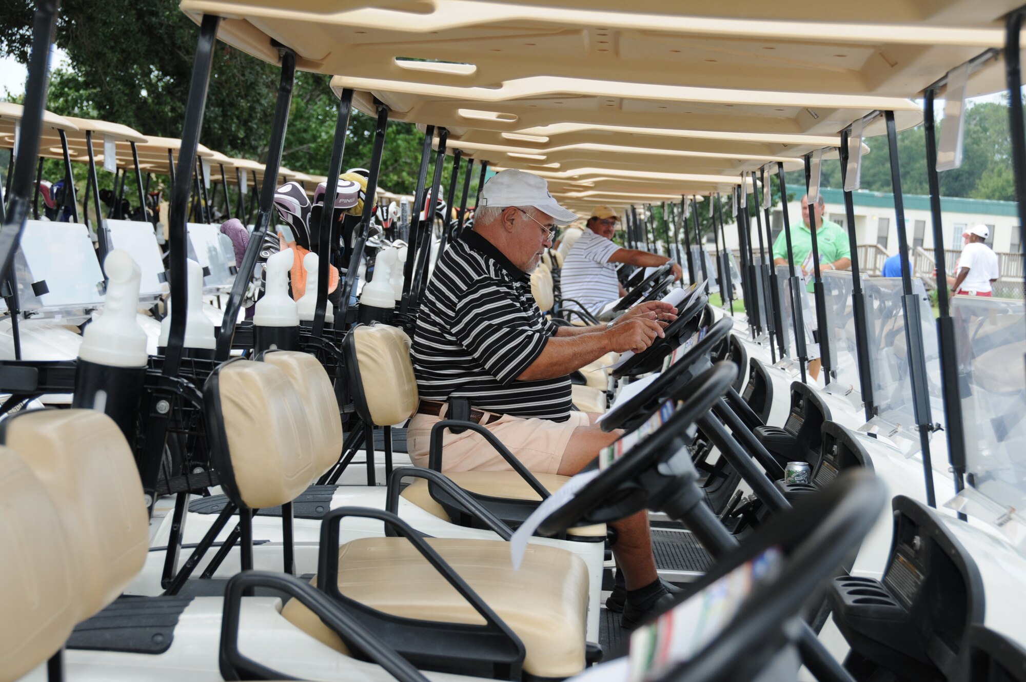Sonny Rametta, a retired Marine from Biloxi, prepares his scorecard while awaiting the start of a free golf tournament Aug. 26.  The event honored Keesler’s loyal golfers for their patience and patronage in the five years since Hurricane Katrina ravaged the base and its golf facility.  (U.S. Air Force photo by Kemberly Groue)