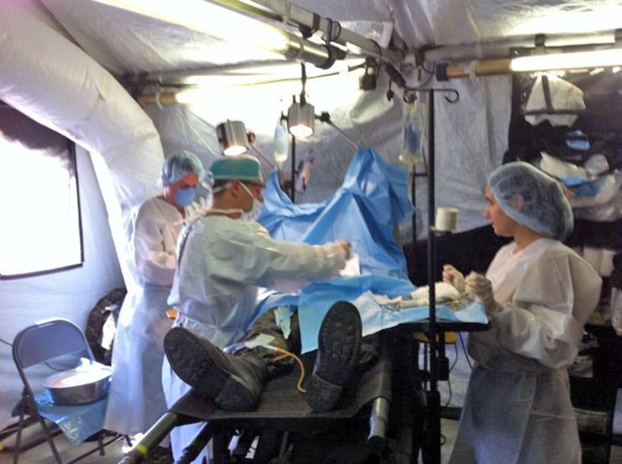 A team of Armenian surgeons simulates a field surgery in an expeditionary medical support system during a three-day exercise Sept. 3, 2010, near Zarh, Armenia. It was the first time the Armenian military had deployed EMEDS to the field. (U.S. Air Force photo/Maj. Dan Zablotzky)