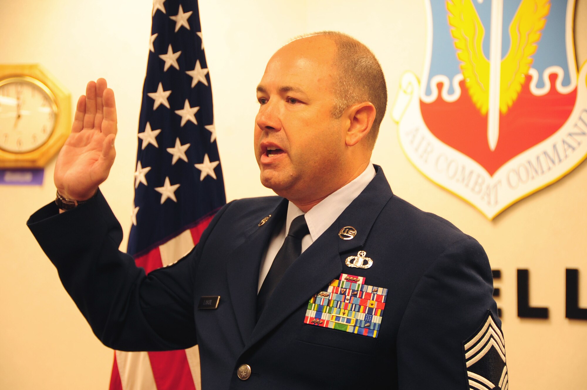 ELLSWORTH AIR FORCE BASE, S.D. -- Chief Master Sgt. Brian Lavoie, 28th Operations Group superintendent, takes the Oath of Enlistment at 26 years, Aug. 27.  Chief Lavoie took the Oath of Enlistment over a video teleconference, while his son, U.S. Navy Ensign Paul Lavoie, swore him in. (U.S. Air Force photo/Airman 1st Class Anthony Sanchelli)