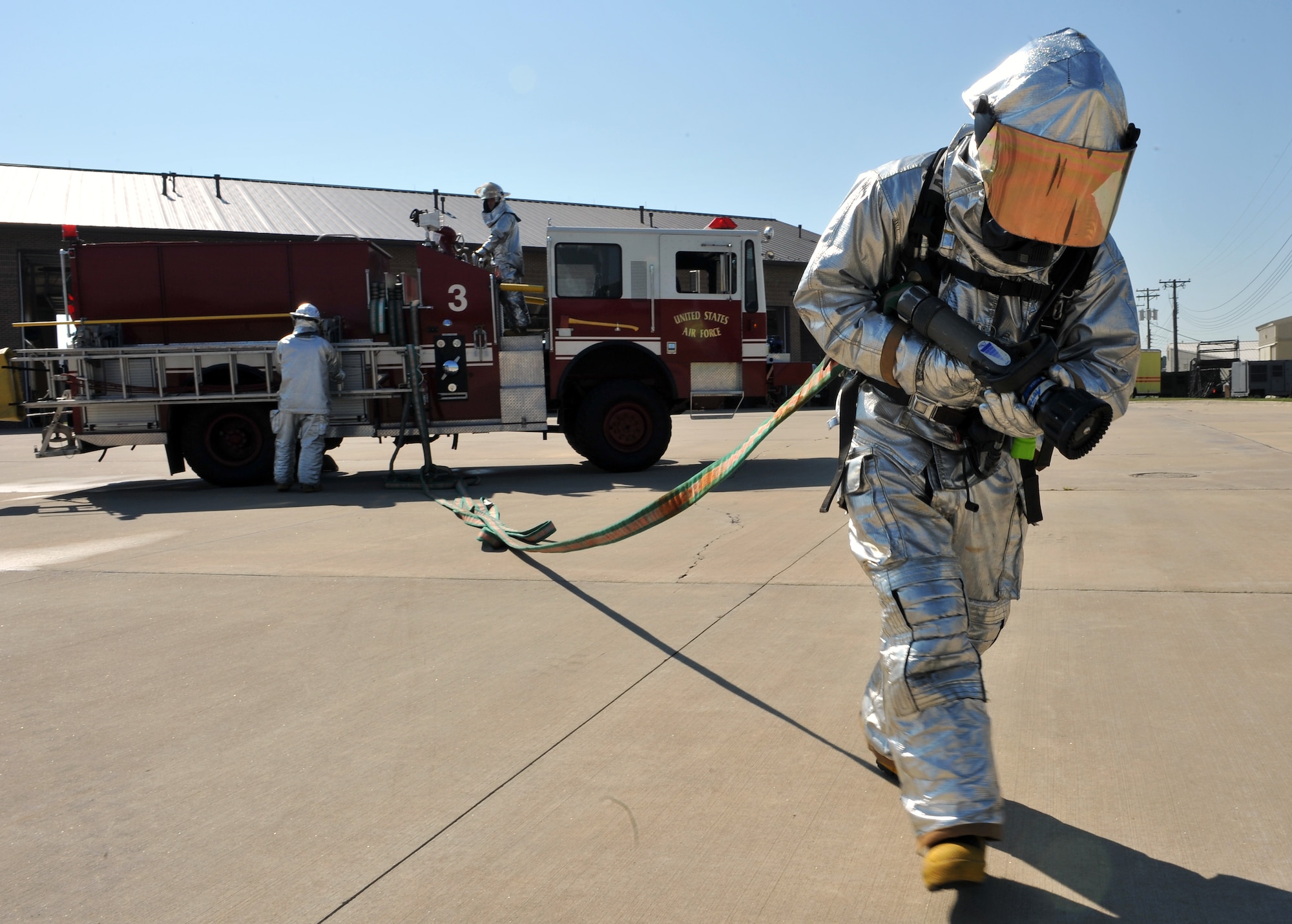 Airman 1st Class Justin Fellure, 19th Civil Engineer Squadron firefighter, runs out a 50 foot attack line Aug. 24 during a simulated C-130 fire response. The fire department motto is “the desire to serve, the ability to perform, and the courage to act.” (U.S. Air Force photo by Staff Sgt. Chris Willis)