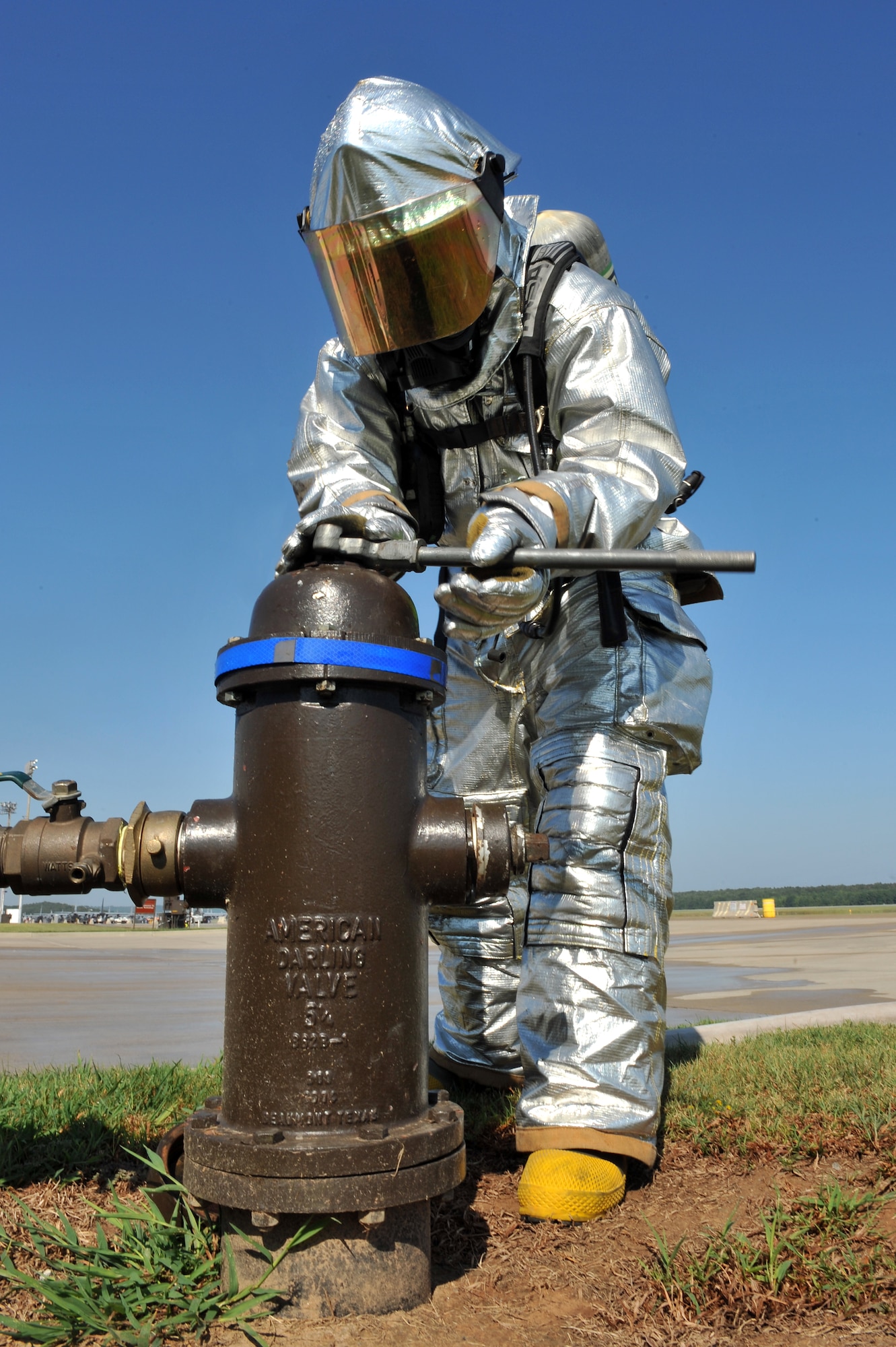 Airman 1st Class Justin Fellure, 19th Civil Engineer Squadron firefighter, opens a fire hydrant located on the base flight line Aug. 24. The Air Force base currently has 58 firefighters assigned and the fire department operates 24 hours, seven days a week. (U.S. Air Force photo by Staff Sgt. Chris Willis)