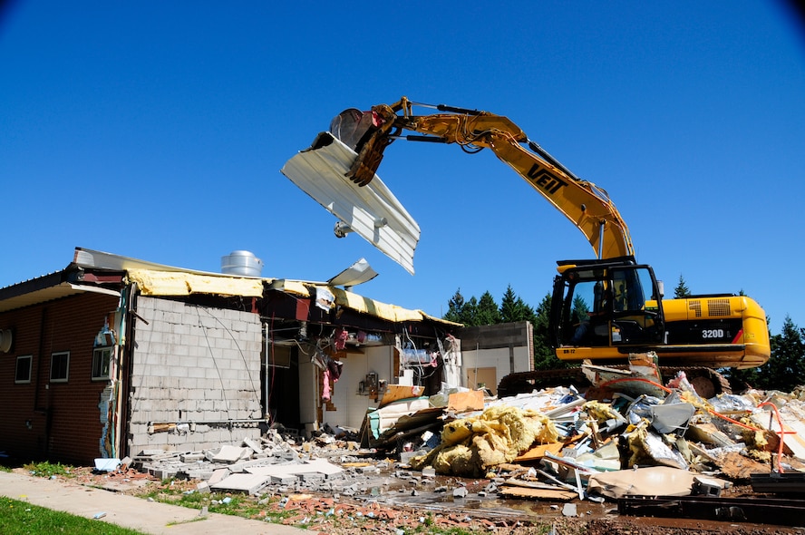 The 148th Fighter Wing in Duluth, MN is tearing down old buildings on base to make room for new construction and expanded parking on August 17, 2010.  The old Multimedia building used to be home to the Services Club but has been vacant for some time.  (U.S. Air Force Photo by SSgt Donald L. Acton)