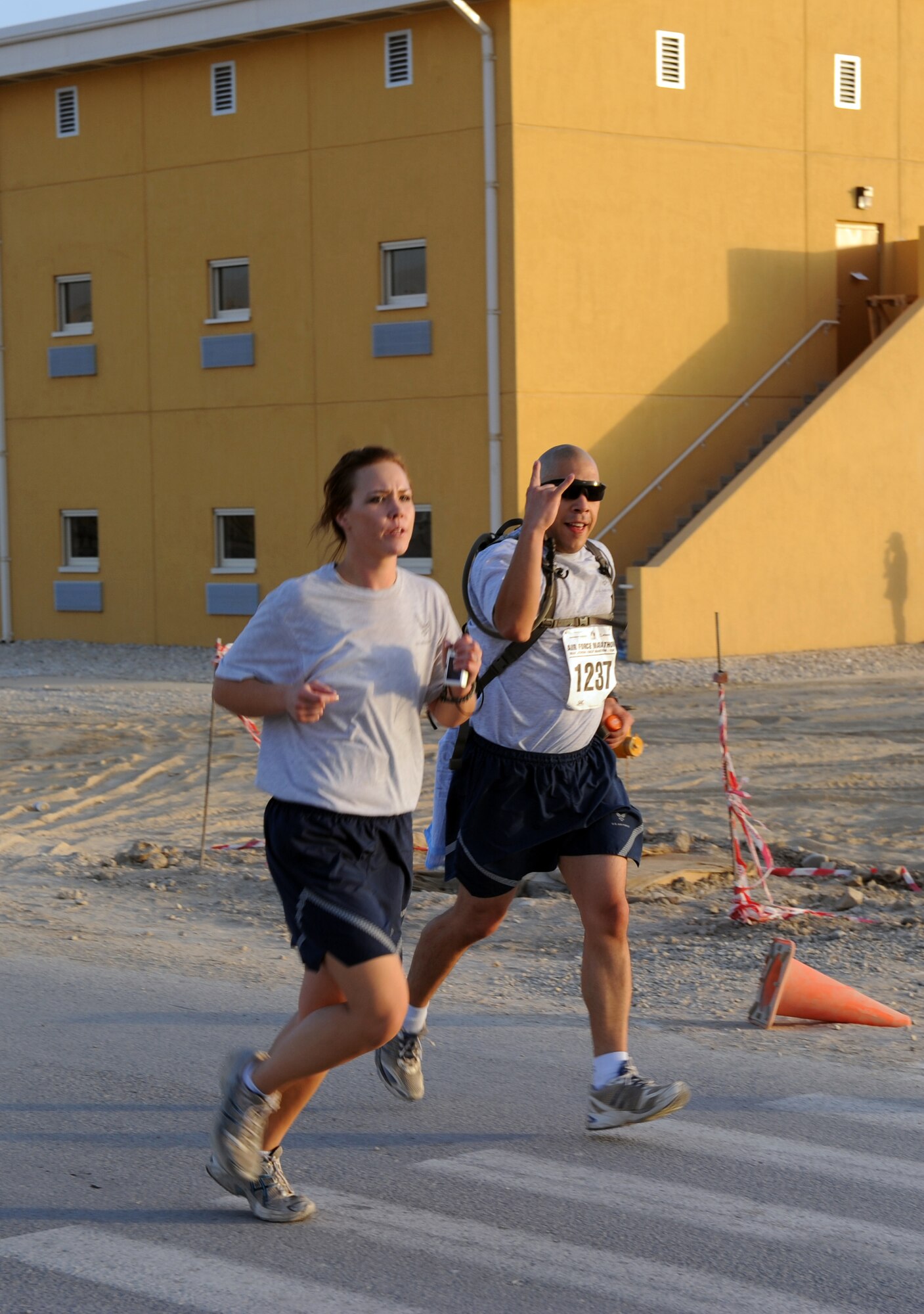 Air Force members show spirit and a can-do attitude while running in the Air Force-sponsored Half Marathon Sept. 4, 2010 at Bagram Airfield, Afghanistan. More than 1,000 members of Team Bagram ran in the event.