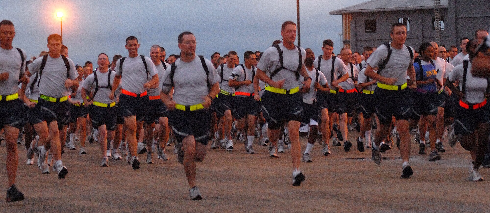 Servicemembers here begin a two mile run at the flightline. The run was the first event of the quarterly Sports Day event Sept. 3. (U.S. Air Force photo/Airman 1st Class Jessica D. Keith)