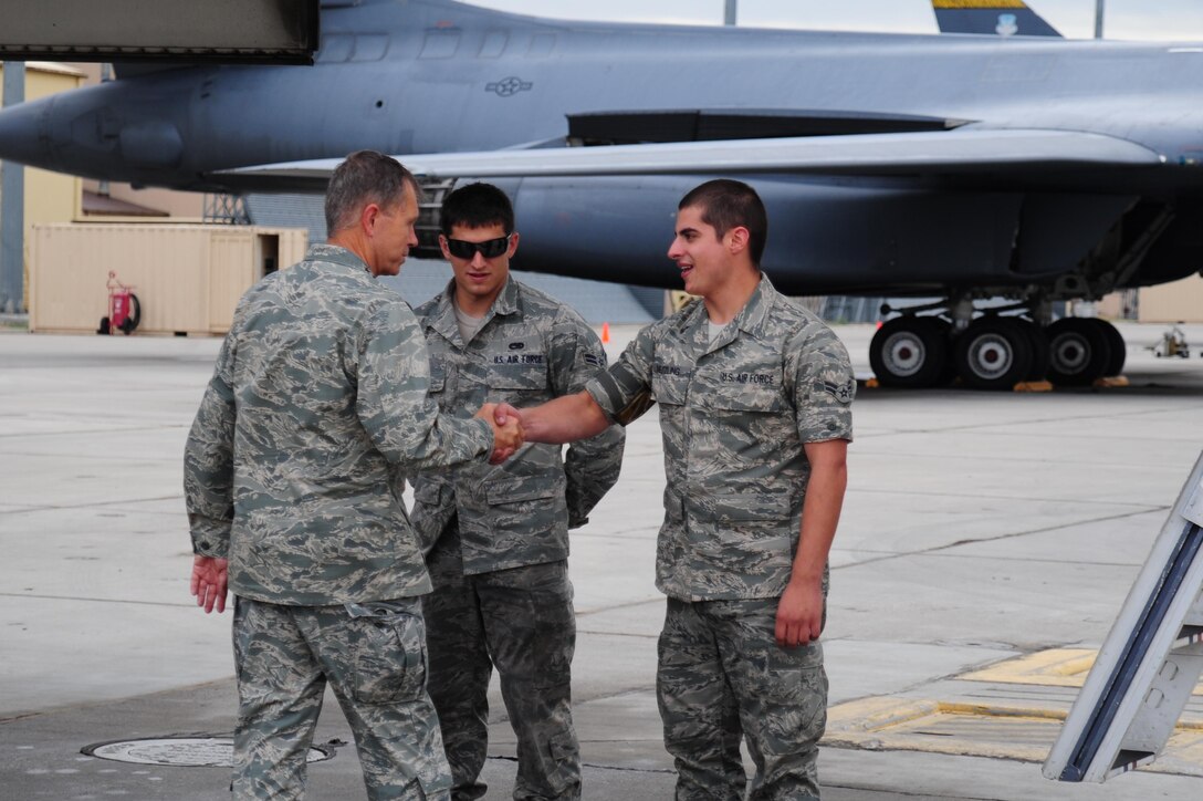 ELLSWORTH AIR FORCE BASE S.D. – Air Combat Command Commander William Fraser III meets Airmen 1st Class Hunter Neutzling and Zachary Ferris, 28th Aircraft Maintenance Squadron crew chiefs, Sept. 1. General Fraser walked the flightline to talk to crew chiefs and maintainers of the 28th Bomb Wing. (U.S. Air Force photo/Senior Airman Corey Hook)