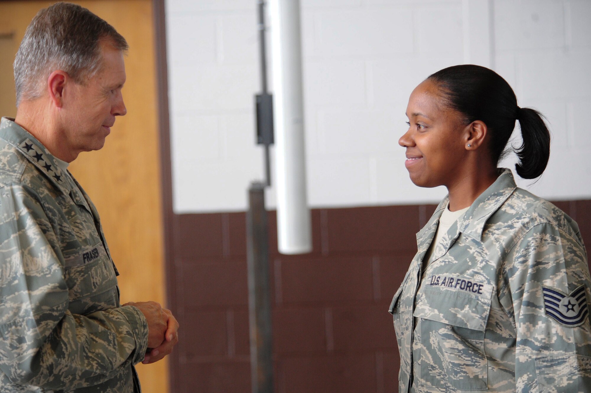 ELLSWORTH AIR FORCE BASE S.D. – (Left) Air Combat Command Commander William Fraser III speaks to Tech. Sgt. Angela Baker, 28th Medical Group administration services NCO in-charge, after a commander’s call, Sept. 1. General Fraser answered questions from Airmen during and after the commander’s call.  (U.S. Air Force photo/Senior Airman Corey Hook)