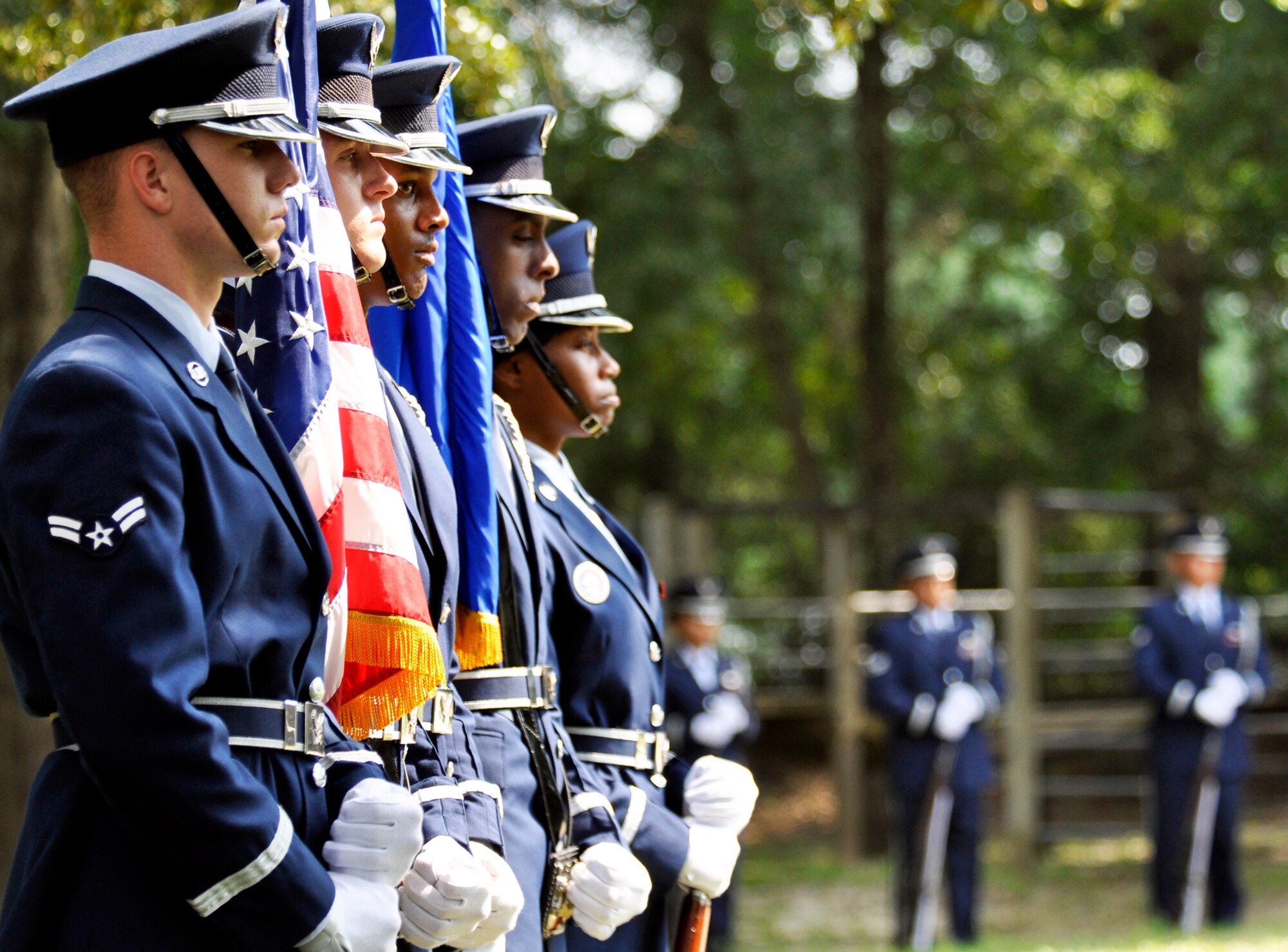Members of the flag detail solemnly stand as the funeral ceremony begins as part of the Eglin honor guard graduation Sept. 3.  The class performs a funeral ceremony with full honors for base leadership before graduating afterward.  The ceremony has four functions to be performed:  the flag detail, the 21-gun salute, pall bearers and bugler.  Eglin’s honor guard holds four classes per year with 15 Airmen graduating this particular class.  (U.S. Air Force photo/Samuel King Jr.)