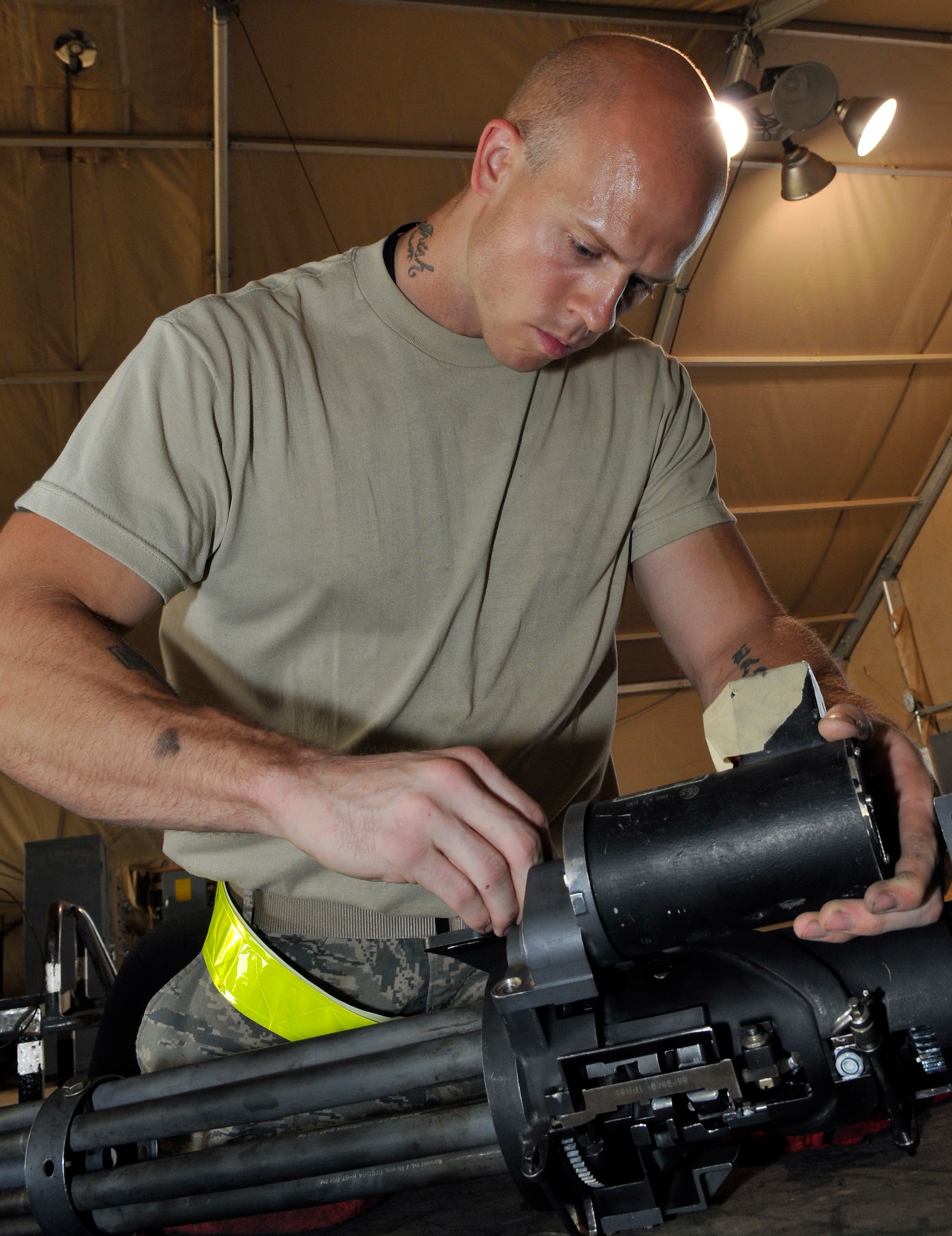 Tech. Sgt. Aaron Slay, 64th Expeditionary Helicopter Maintenance Unit weapons specialist, attaches a gun-motor drive on a GAU-2 7.62 mm minigun after an inspection and cleaning Sept. 7, 2010, Joint Base Balad, Iraq. In popular culture, the term "minigun" has come to refer to any externally-powered Gatling gun. Sergeant Slay is a native of Ashville, Ohio, deployed from Nellis Air Force Base. (U.S. Air Force photo/Staff Sgt. Phillip Butterfield)
