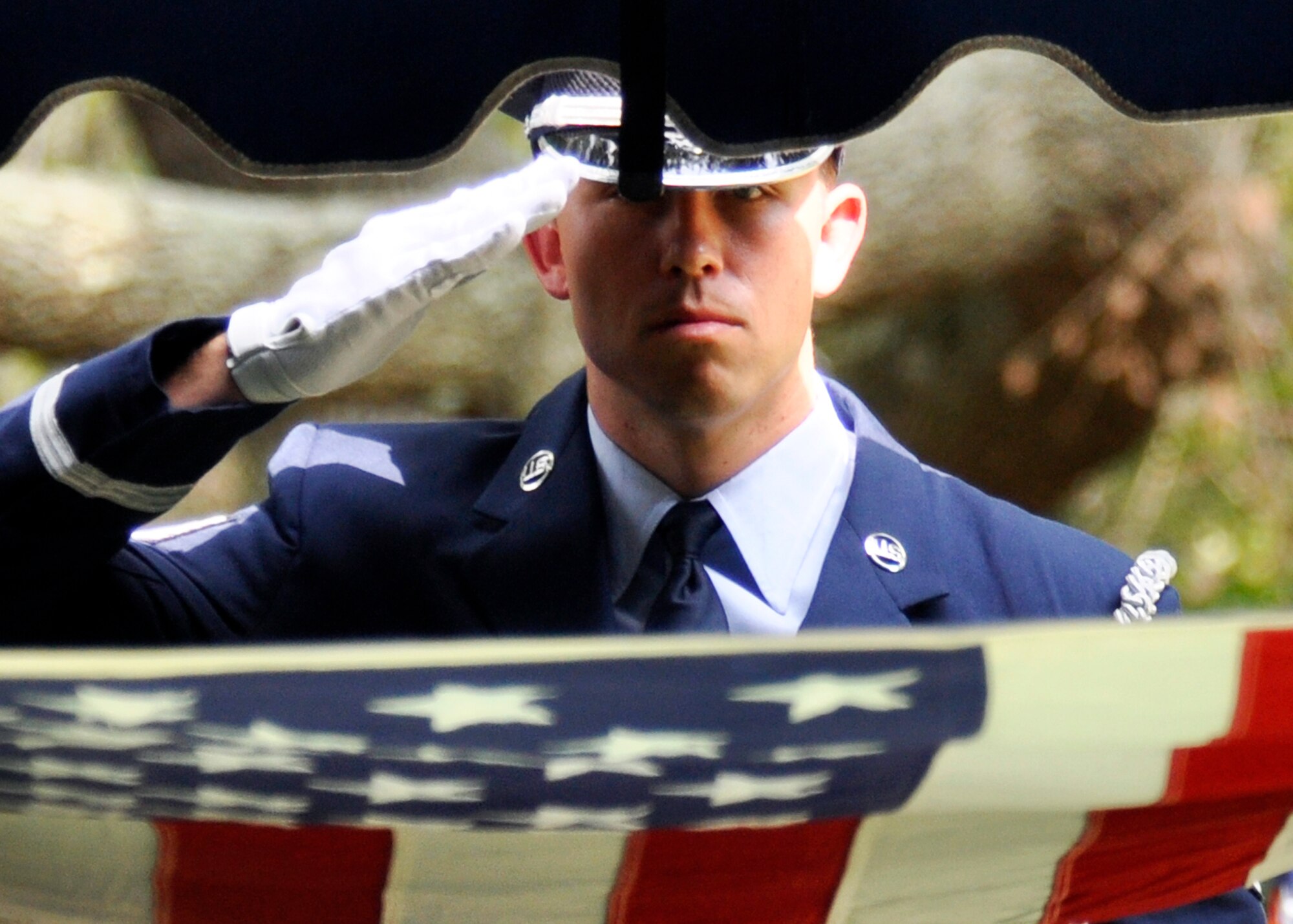 Staff Sgt. Raymond Stead, Eglin honor guard, salutes the flag during a mock funeral as part of the honor guard graduation Sept. 3.  The class performs a funeral ceremony with full honors for base leadership before graduating afterward.  The ceremony has four honor guard functions to be performed:  the flag detail, the 21-gun salute, pall bearers and bugler.  Eglin’s honor guard holds four classes per year with 15 Airmen graduating this particular class.  (U.S. Air Force photo/Samuel King Jr.)