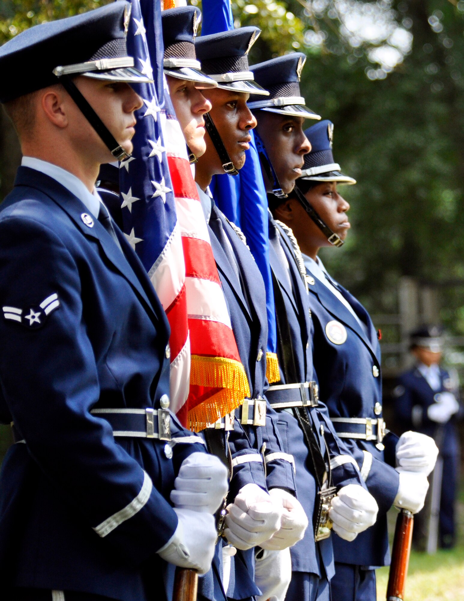 Members of the flag detail solemnly stand as the funeral ceremony begins as part of the Eglin honor guard graduation Sept. 3.  The class performs a funeral ceremony with full honors for base leadership before graduating afterward.  The ceremony has four functions to be performed:  the flag detail, the 21-gun salute, pall bearers and bugler.  Eglin’s honor guard holds four classes per year with 15 Airmen graduating this particular class.  (U.S. Air Force photo/Samuel King Jr.)