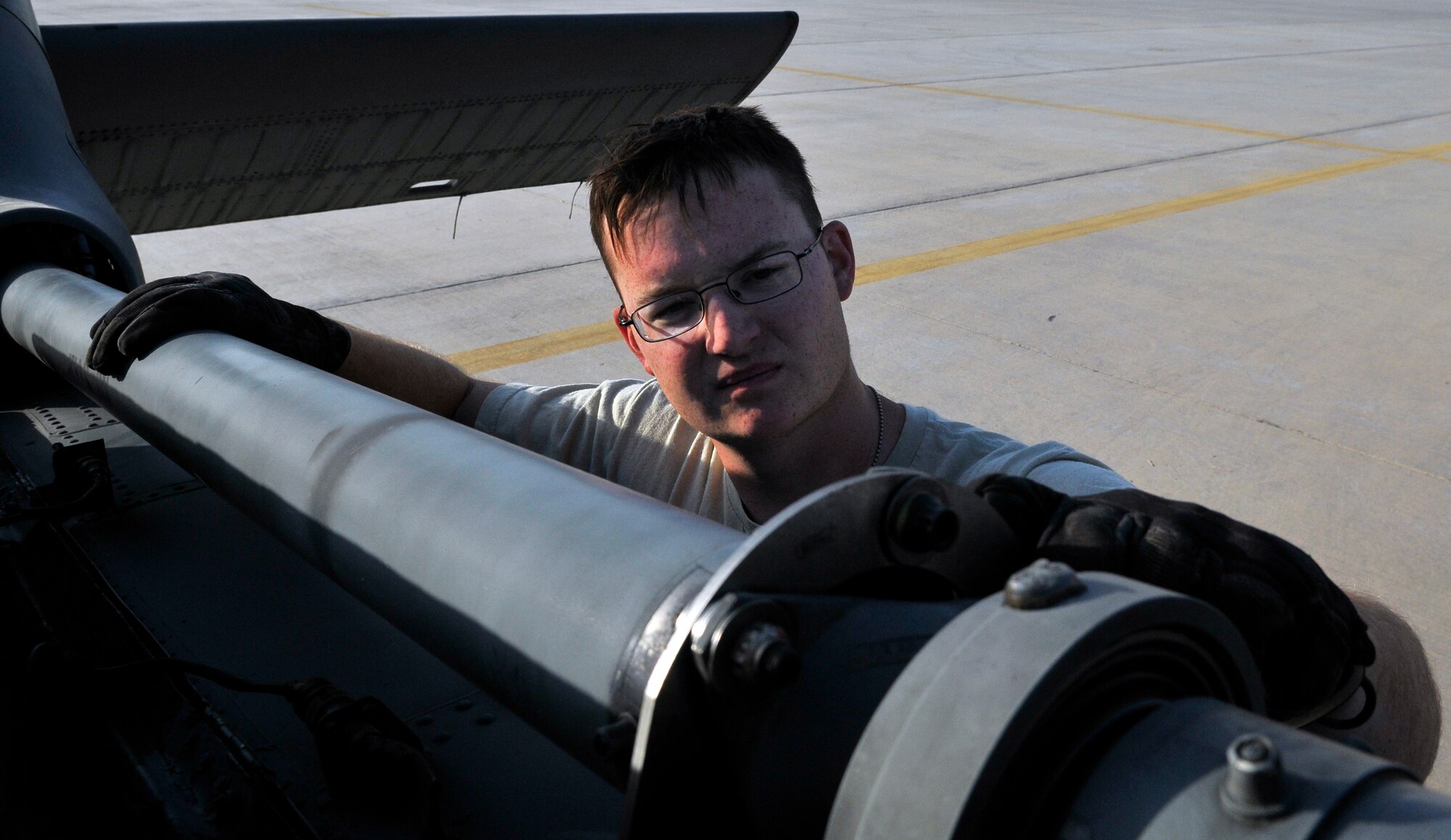 Airman 1st Class Thomas Glenn, 64th Expeditionary Helicopter Maintenance Unit crew chief, performs a pre-flight inspection on a HH-60 Pave Hawk helicopter’s tail rotor drive shaft Sept. 7, 2010, Joint Base Balad, Iraq. Crew chiefs perform multiple inspections to include through and post-flight inspections, ensuring the aircraft is ready for flight. Airman Glenn is a native of Saint Joe, Ark., deployed from Nellis Air Force Base. (U.S. Air Force photo/Staff Sgt. Phillip Butterfield)